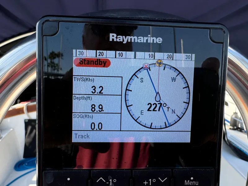 Raymarine navigation display on 1989 Catalina Sloop showing compass heading and depth.
