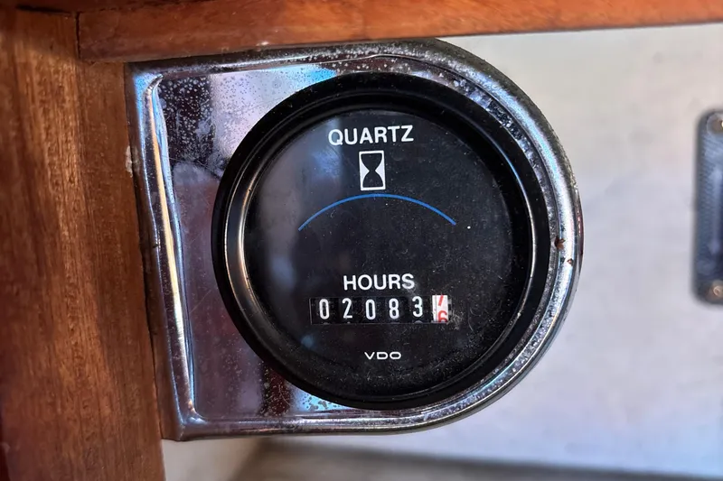 Quartz hour meter showing 2083 hours on a 1977 Baba 30 model.