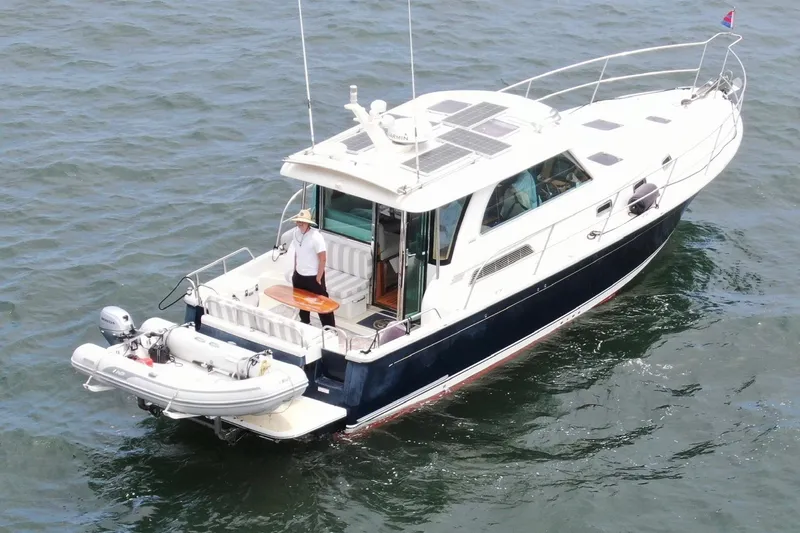 2016 Sabre 38 Salon Express yacht on water with a person on deck.