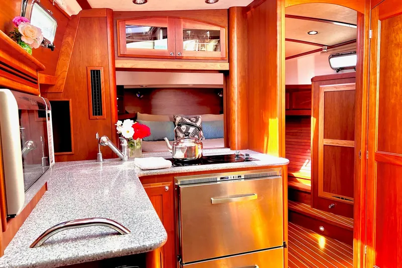 Luxurious interior of 2016 Sabre 38 Salon Express yacht with modern kitchen amenities.