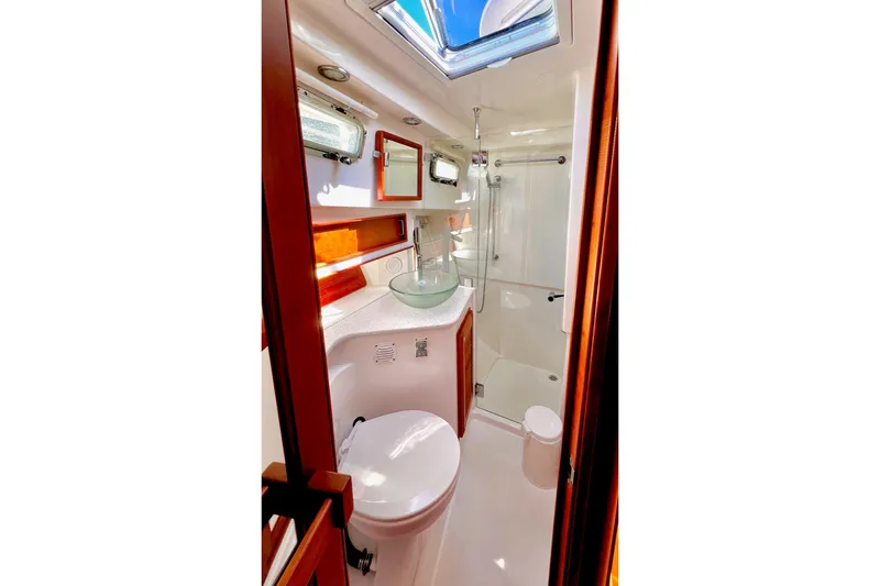 Luxurious bathroom in 2016 Sabre 38 Salon Express yacht with modern fixtures and skylight.