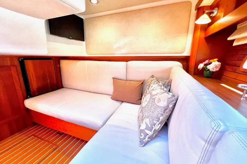 Luxurious interior of 2016 Sabre 38 Salon Express yacht with plush seating and elegant decor.