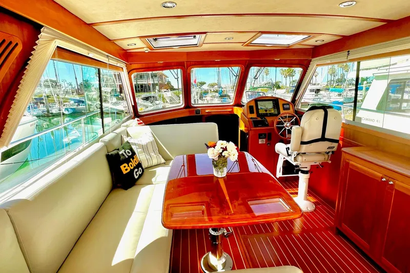 Luxurious interior of 2016 Sabre 38 Salon Express yacht with elegant seating and helm.