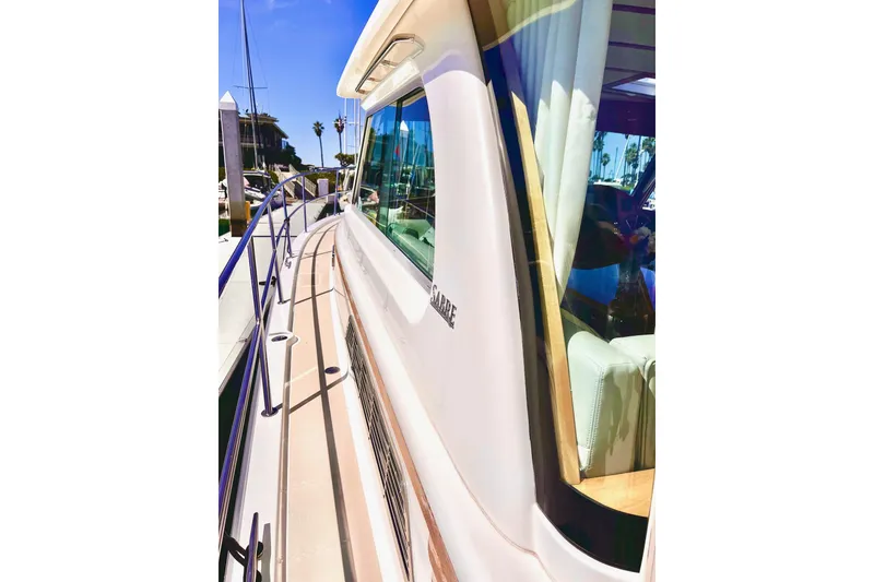 2016 Sabre 38 Salon Express yacht side view with sleek design and marina backdrop.
