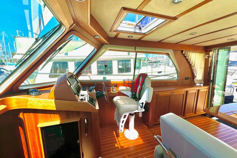 Interior of 2016 Sabre 38 Salon Express yacht with wooden finishes and helm station.