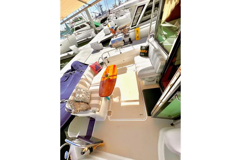 2016 Sabre 38 Salon Express yacht interior with seating and table at marina.