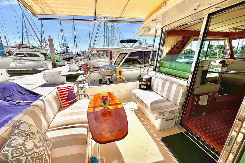 Luxurious 2016 Sabre 38 Salon Express yacht interior with striped seating and elegant decor.