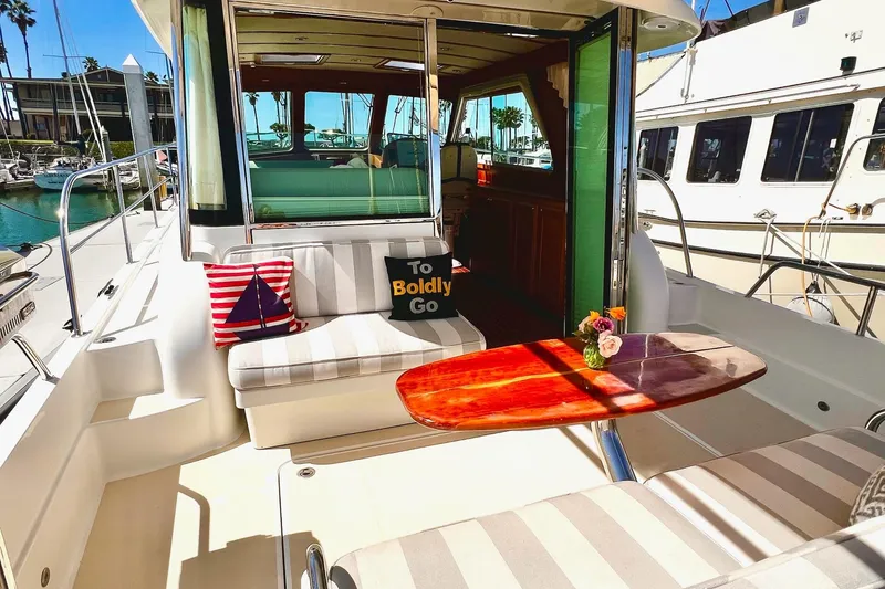 Luxurious 2016 Sabre 38 Salon Express yacht interior with stylish seating and decorative pillows.