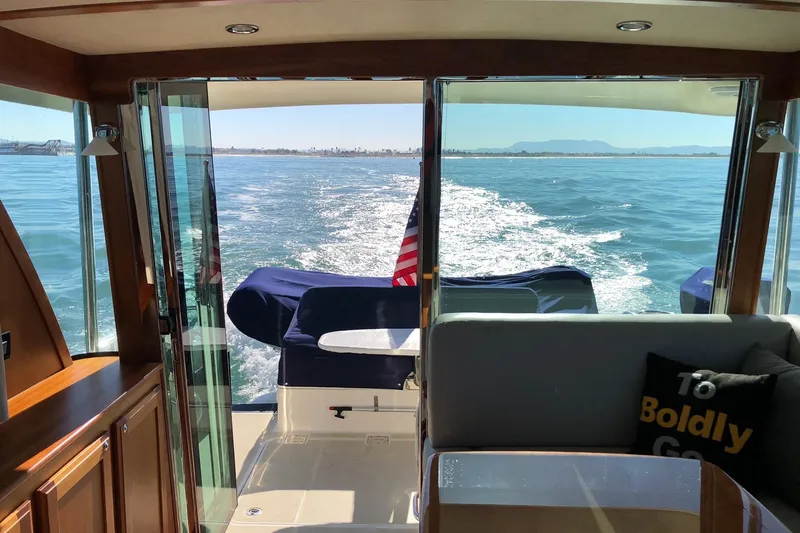 Interior view of 2016 Sabre 38 Salon Express yacht cruising on open water.