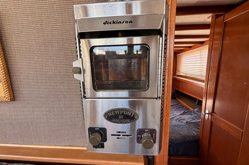 Stainless steel heater inside a 1974 Skookum 34 boat cabin.