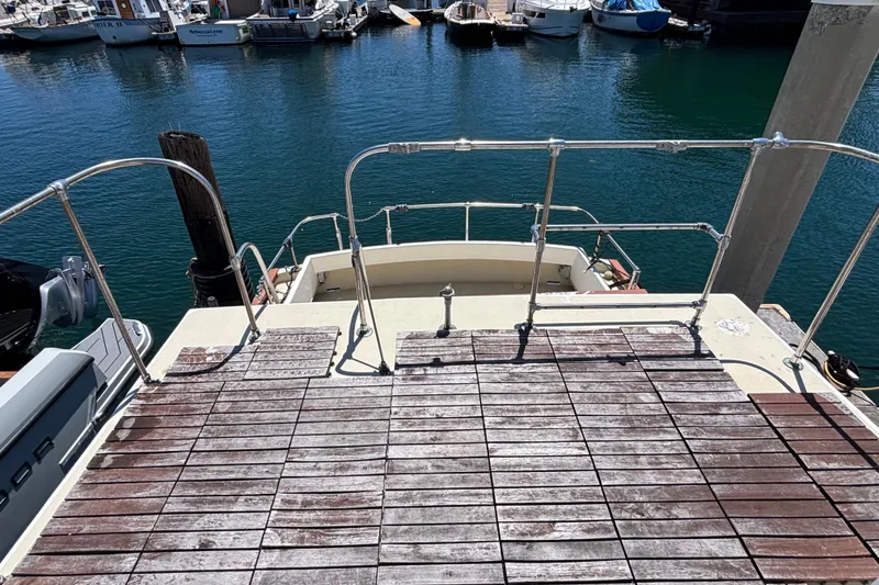 1974 Skookum 34 boat deck overlooking marina with moored boats.