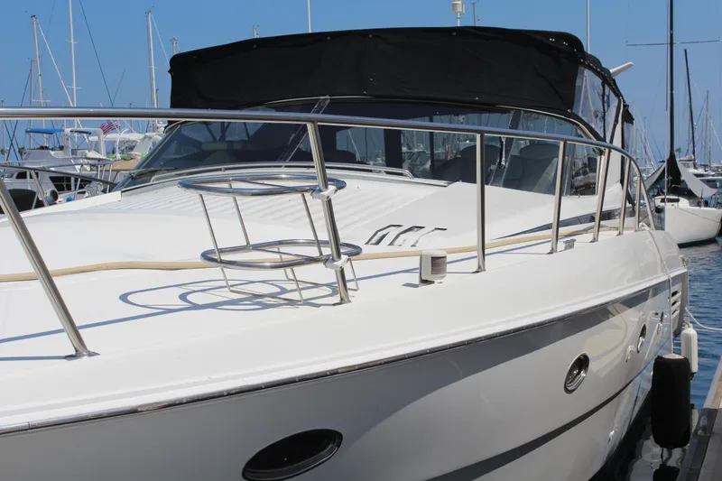 1996 Trojan 440 Express yacht docked at marina, featuring sleek design and modern amenities.