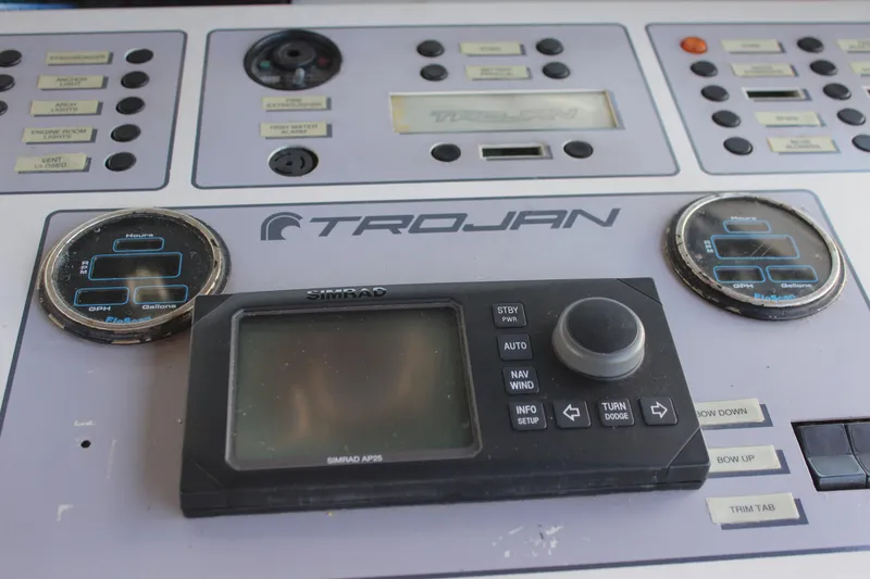 Control panel of a 1996 Trojan 440 Express boat with navigation instruments.