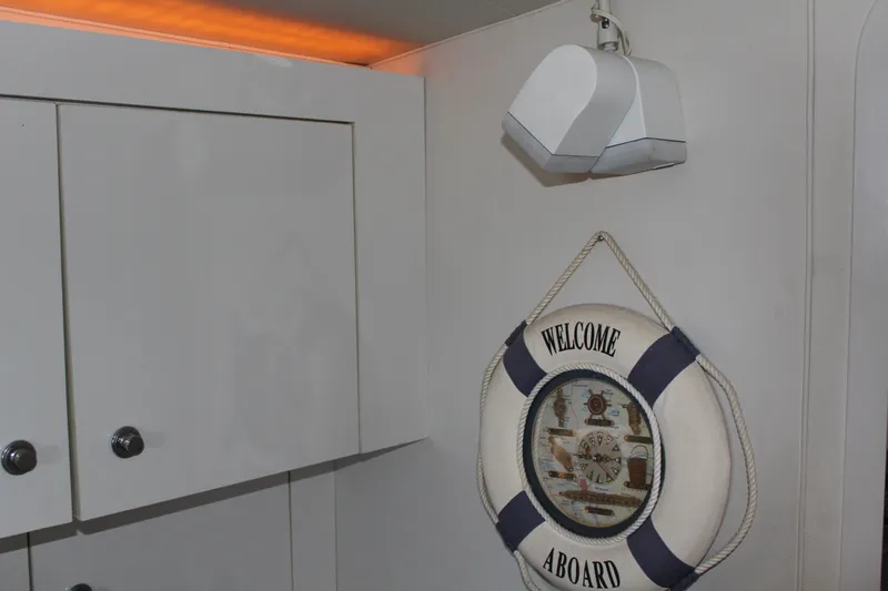 "Welcome Aboard" life preserver on 1996 Trojan 440 Express boat interior wall.
