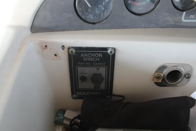Control panel of a 1996 Trojan 440 Express boat with anchor winch remote.
