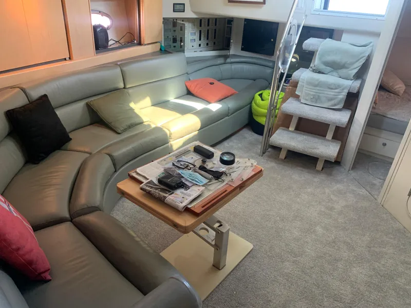 Luxurious interior of a 1996 Trojan 440 Express yacht with plush seating and modern amenities.