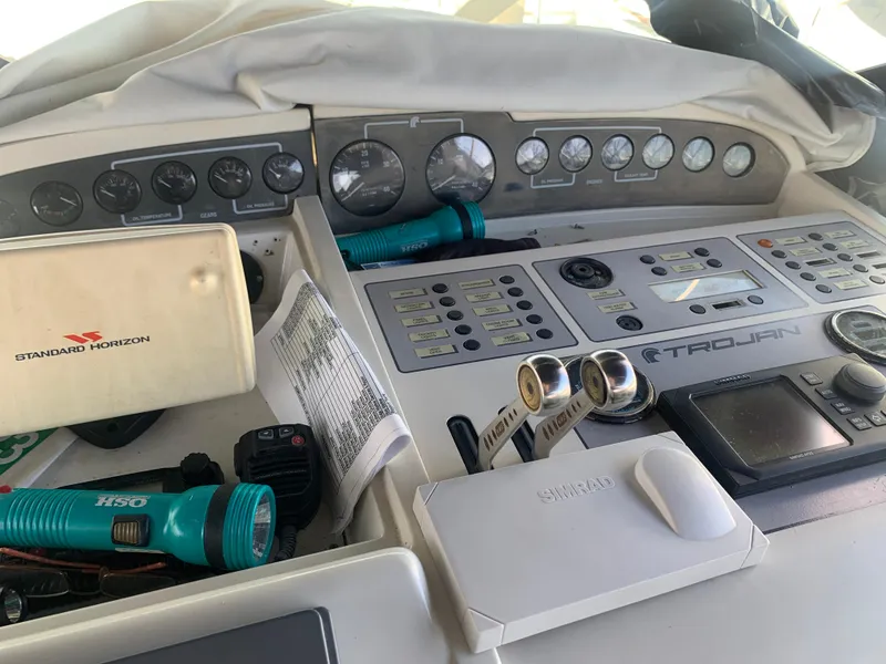 Control panel of a 1996 Trojan 440 Express boat with navigation equipment.