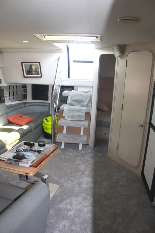 Interior of 1996 Trojan 440 Express yacht with modern seating and decor.