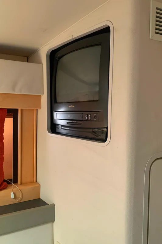 Built-in TV in a 1996 Trojan 440 Express boat interior.