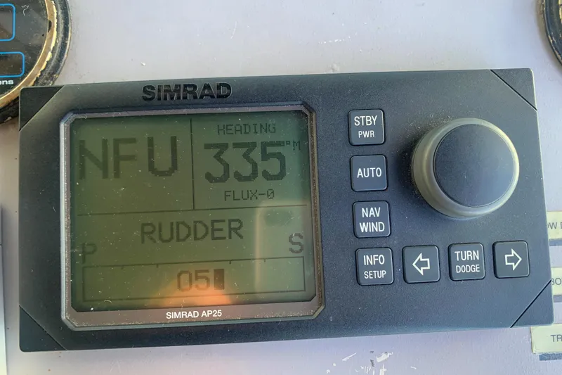 Simrad AP25 autopilot display on 1996 Trojan 440 Express, showing heading 335 degrees.