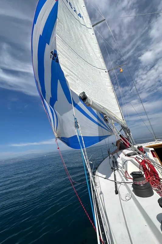 1985 C&C 41 sailboat on calm sea.