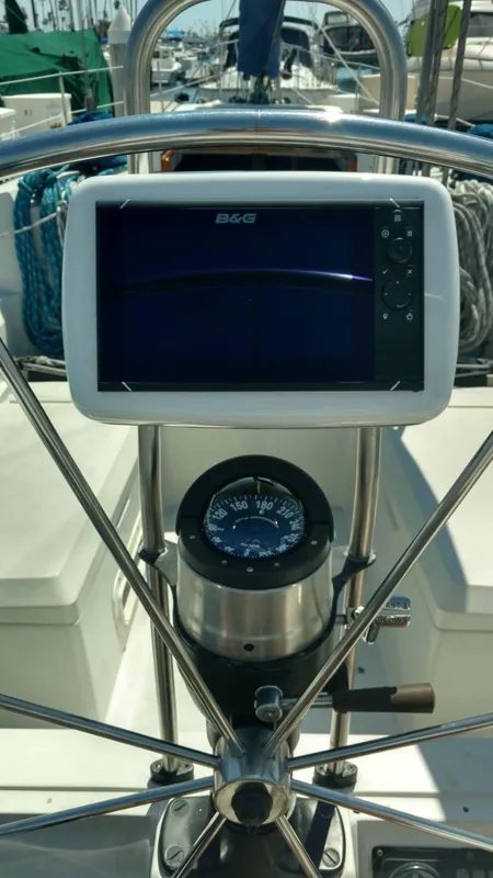 Steering wheel and navigation system on a 1985 C&C 41 yacht.