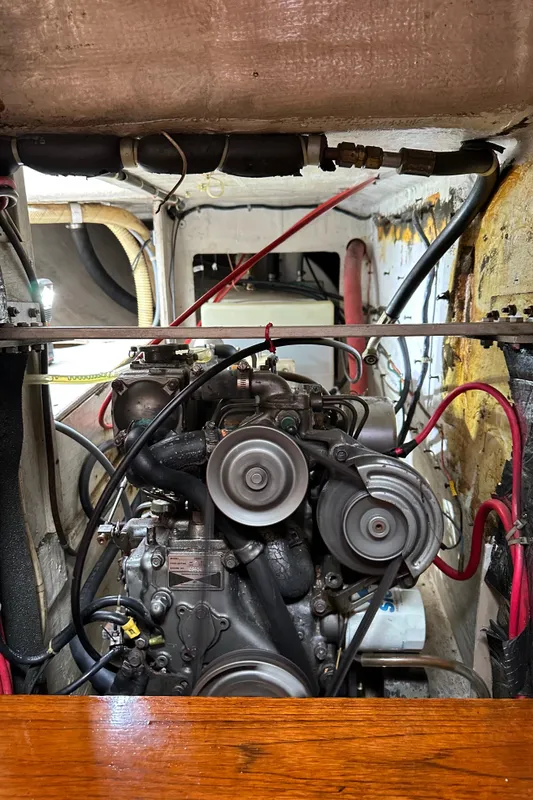 Engine compartment of a 1985 C&C 41 sailboat with visible wiring.