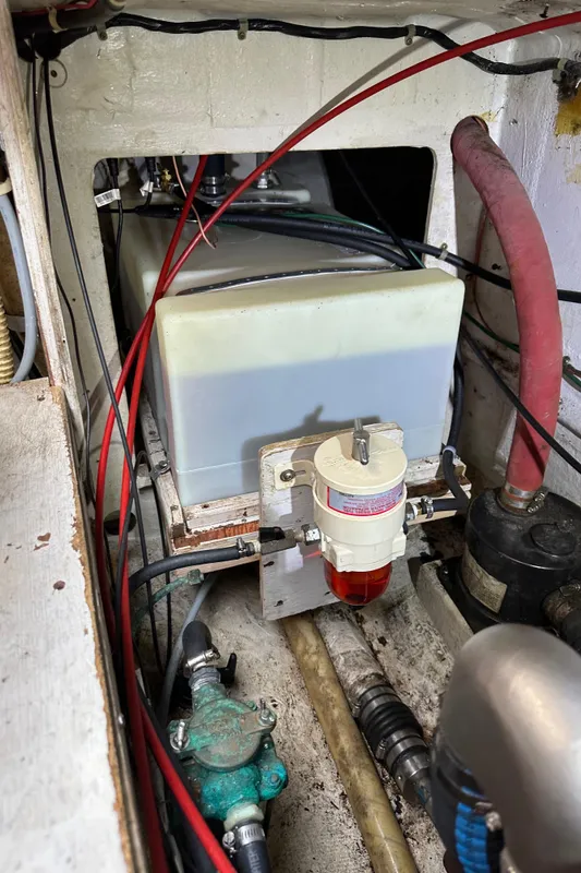 Engine compartment of a 1985 C&C 41 sailboat with fuel filter.