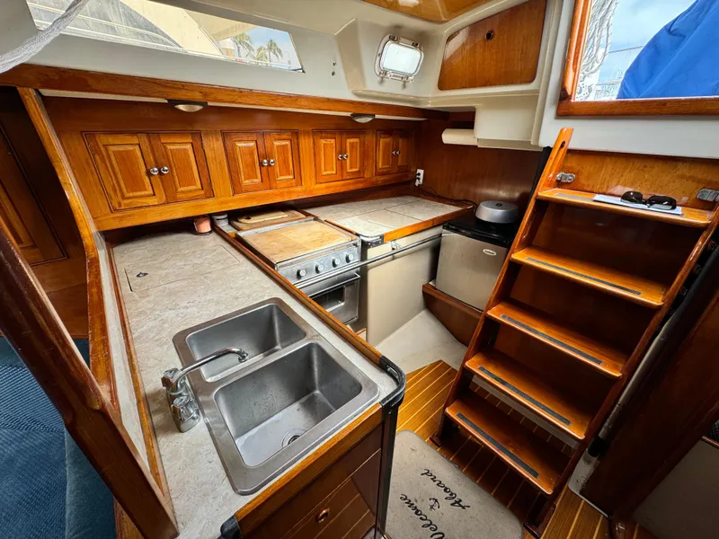 Interior of a 1985 C&C 41 yacht with wooden cabinetry.