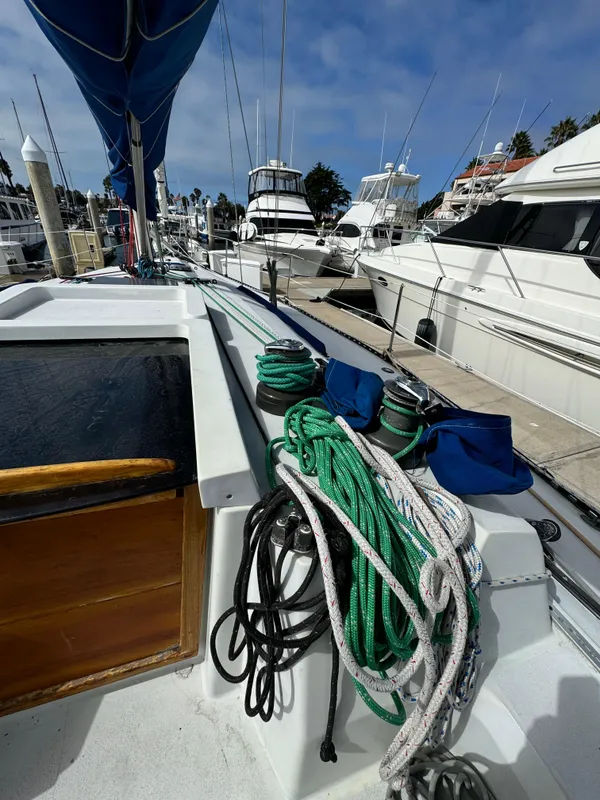 1985 C&C 41 sailboat docked with ropes and equipment.
