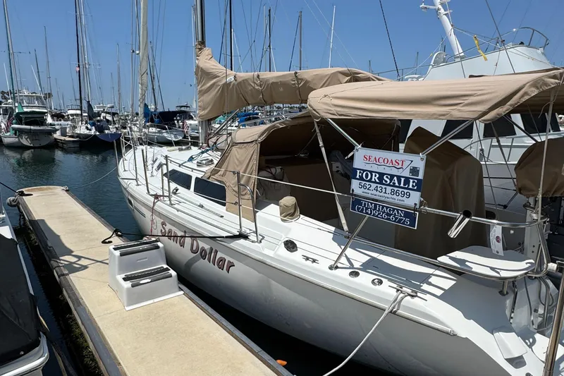 1998 Catalina 36 MkII sailboat "Sand Dollar" for sale at marina dock.
