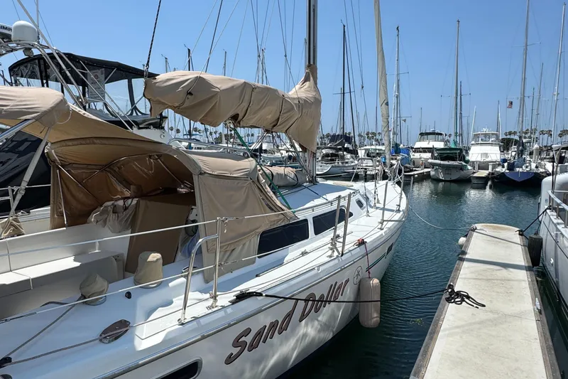 1998 Catalina 36 MkII sailboat named "Sand Dollar" docked at a marina.