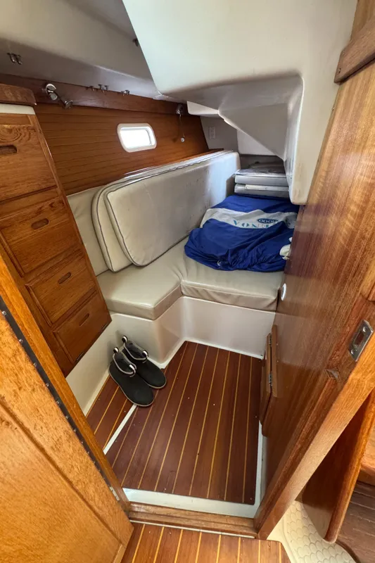 Interior cabin of 1998 Catalina 36 MkII sailboat with wooden finish and cozy seating.