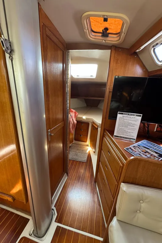 Interior of 1998 Catalina 36 MkII sailboat with wood finish and cozy cabin.