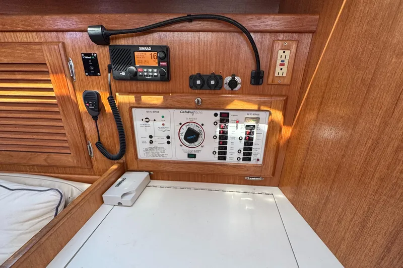 Control panel of a 1998 Catalina 36 MkII sailboat with radio and switches.