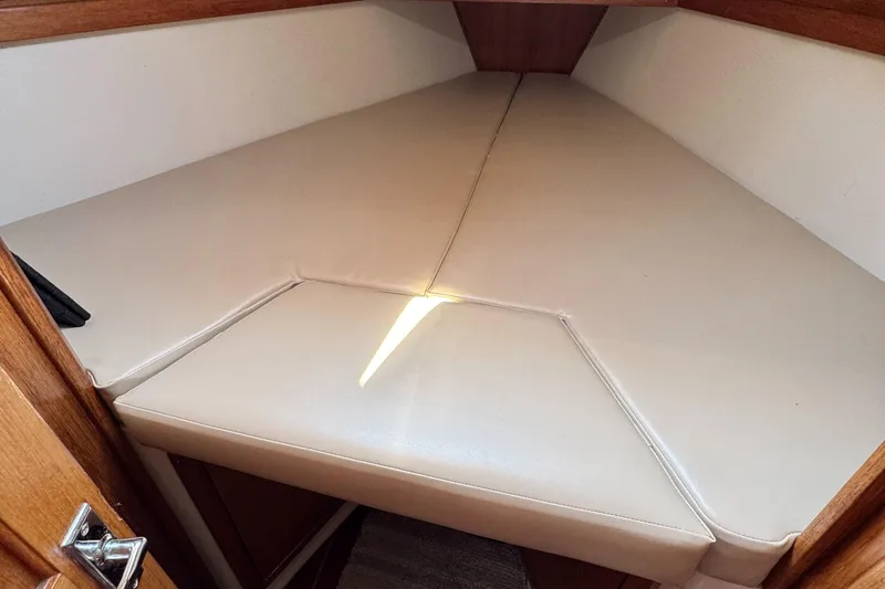 Interior cabin of 1998 Catalina 36 MkII sailboat with beige cushions.