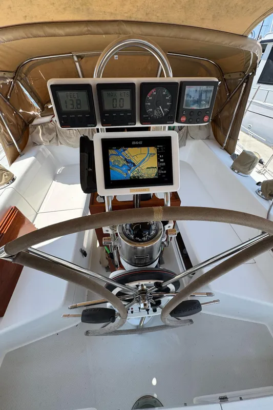 Cockpit of 1998 Catalina 36 MkII sailboat with navigation instruments and steering wheel.