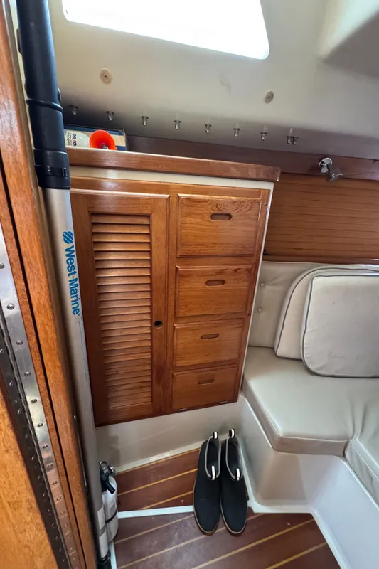 Interior of 1998 Catalina 36 MkII sailboat with wooden cabinetry and seating.