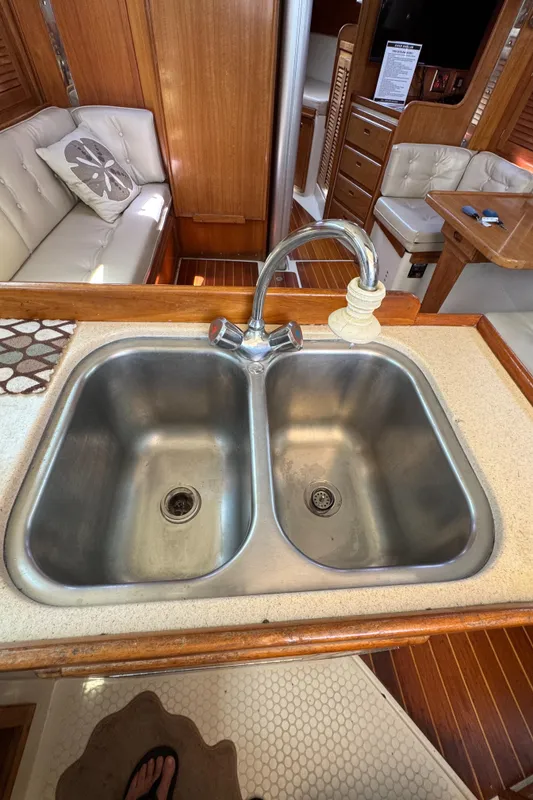 1998 Catalina 36 MkII yacht interior with double sink and wooden cabinetry.