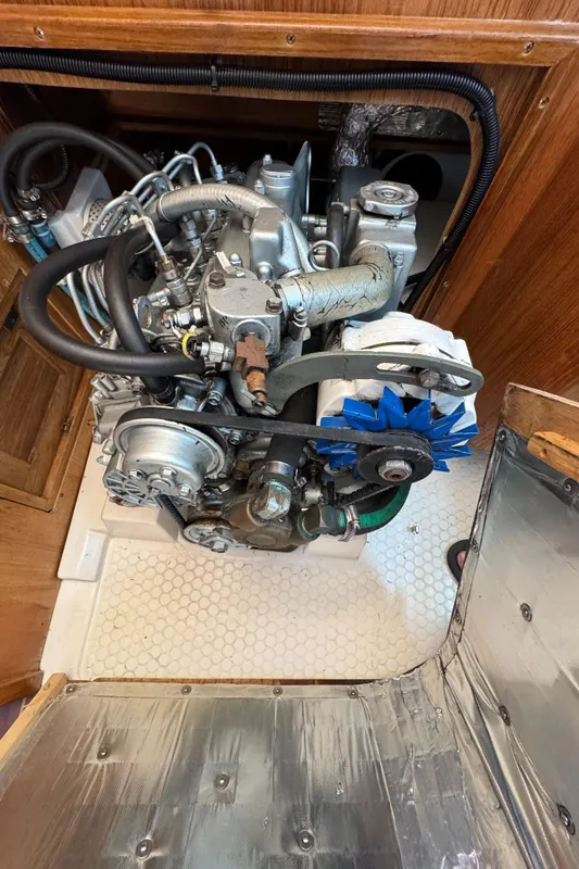 Engine compartment of a 1998 Catalina 36 MkII sailboat, showcasing detailed mechanical components.