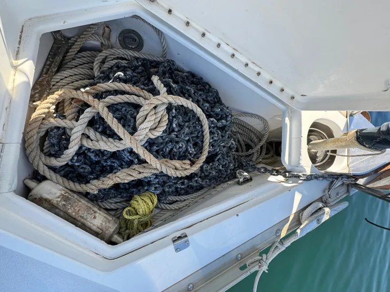 Anchor locker of 1992 Hunter 35 sailboat with ropes and equipment.