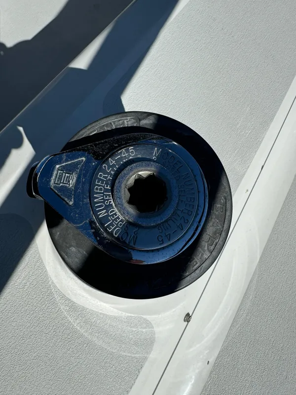Close-up of a 1992 Hunter 35 sailboat deck fitting in sunlight.