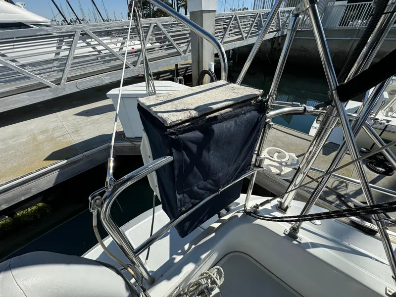 Sailboat deck with stainless steel railings, Hunter 35 model, 1992, docked at marina.