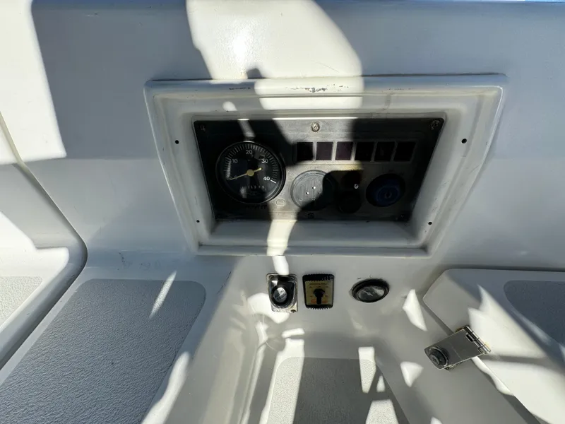 Control panel of a 1992 Hunter 35 boat with gauges and switches.