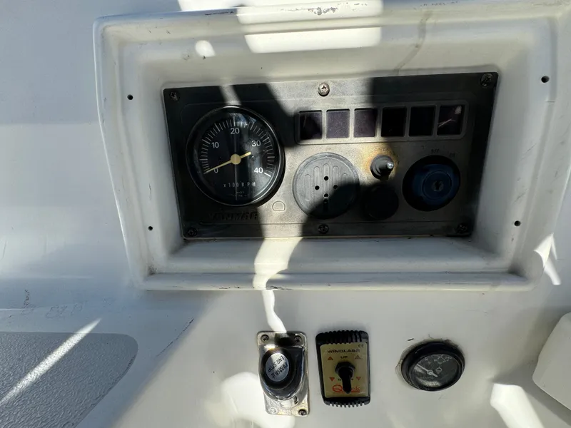 Control panel of a 1992 Hunter 35 boat with gauges and switches.