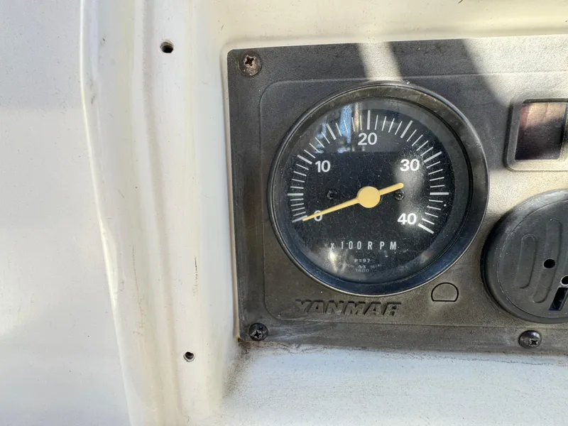 Yanmar RPM gauge on a 1992 Hunter 35 boat dashboard.
