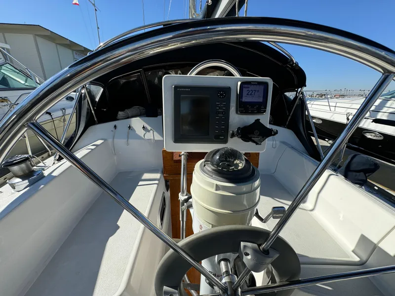 1992 Hunter 35 sailboat cockpit with steering wheel and navigation instruments.