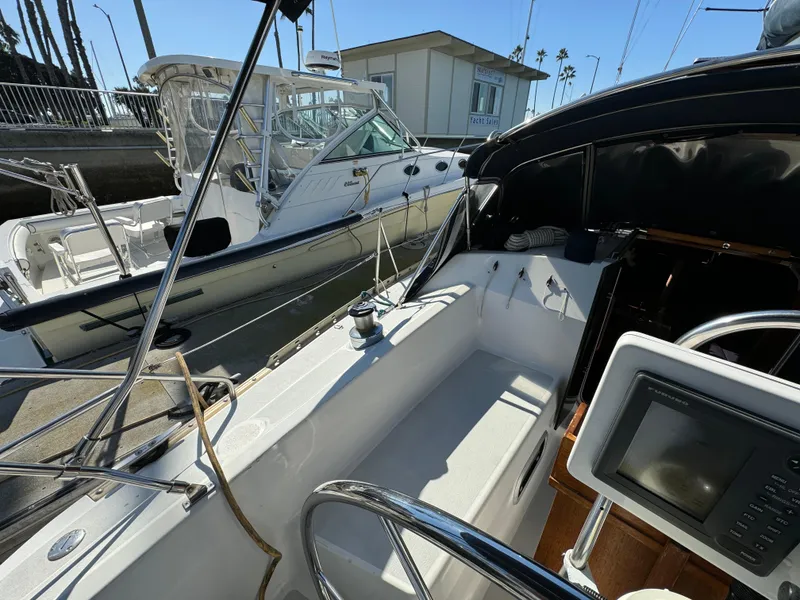Cockpit view of a 1992 Hunter 35 sailboat docked at a marina.