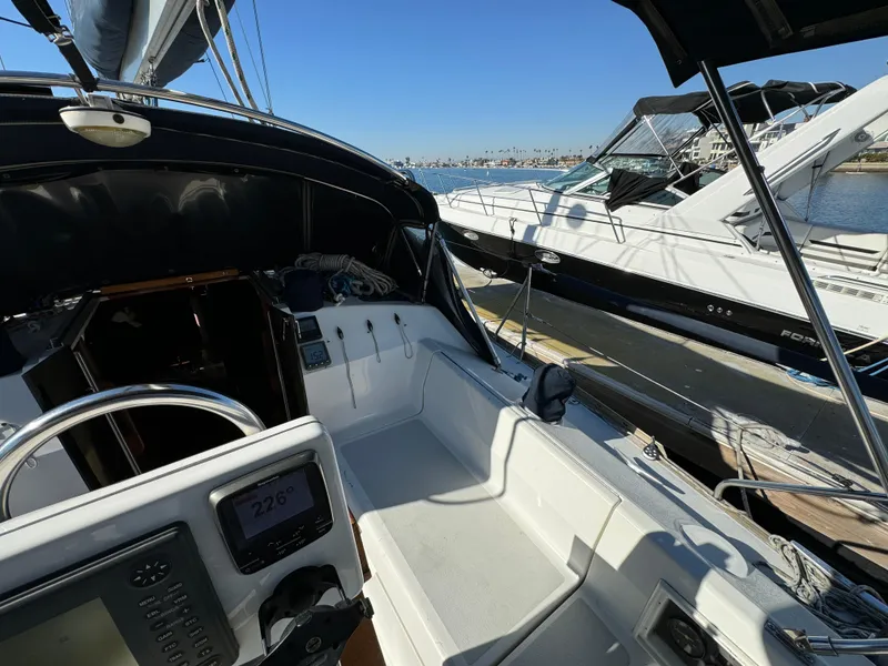 Cockpit view of a 1992 Hunter 35 sailboat docked at a marina.