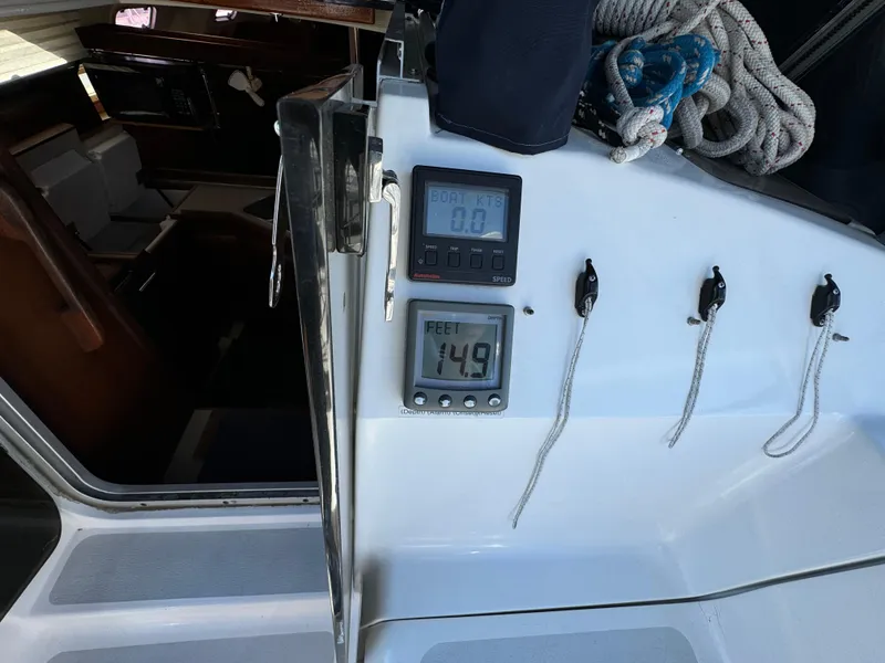 Interior view of a 1992 Hunter 35 sailboat cockpit with navigation instruments.